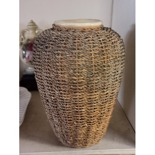 694 - 27 cm tall wicker encased ceramic vase