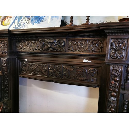 576a - Very heavily carved late 19th century Welsh oak fire surround measuring approx 250 x 197 cm, stunnin... 