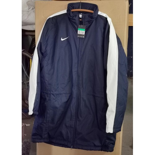 99 - New and tagged navy and white Nike padded stadium jacket size XL