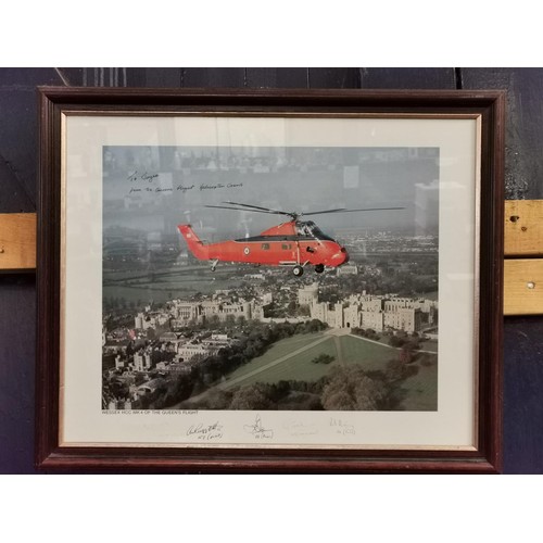 105 - 56.5 x 47 cm framed and mounted aerial photograph of the queens flight in Wessex helicopter, hand si... 