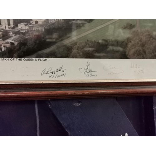 105 - 56.5 x 47 cm framed and mounted aerial photograph of the queens flight in Wessex helicopter, hand si... 