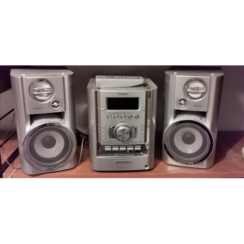 173 - Silver Sony micro hi-fi component system model CMT-HP7 with speakers and remote control