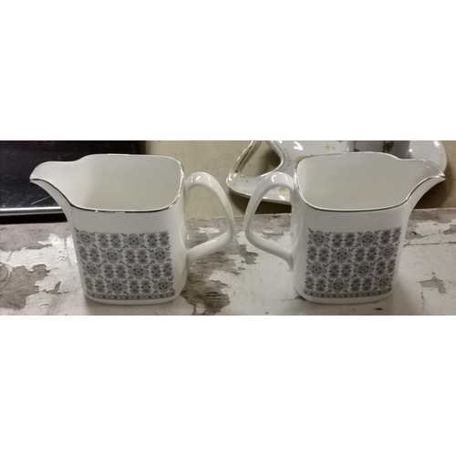 144 - Pair of Royal Doulton H5025 counterpoint milk jugs