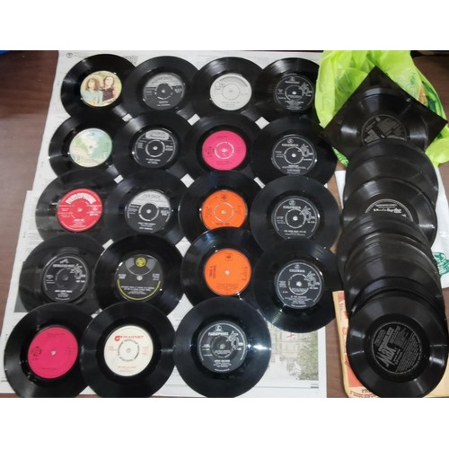 49 - Bundle of assorted vinyl singles without sleeves & assorted floppy vinyl