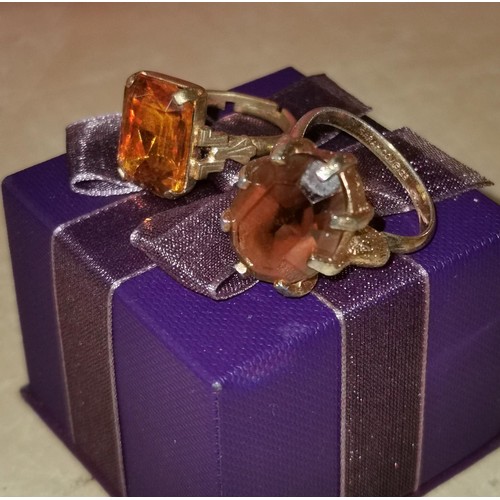 95 - 2 x large gold tone with large amber colour stone dress rings, 1 being Sarah Coventry