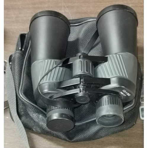 23 - Pair of 10 x 50 field binoculars in Chinon carry case