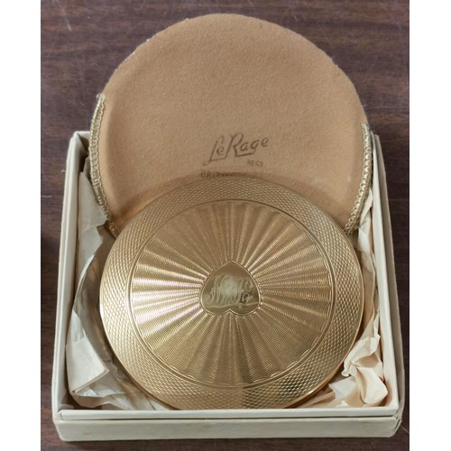 92 - Vintage large gold tone 9 cm diameter compact in original box and with pouch, monogrammed front