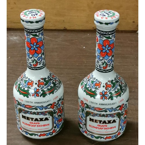 86 - Pair of 1988 Metaxa grand Olympian reserve porcelain bottles