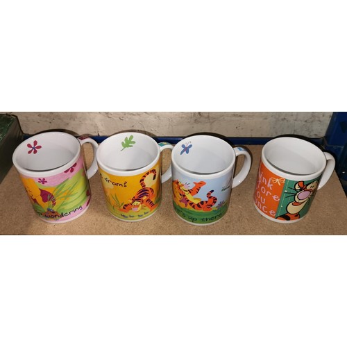 230 - 3 x Disney Store and 1 x other similar Winnie the Pooh mugs