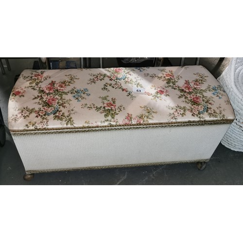 63 - Vintage Spinney rounded end ottoman on wheels, similar to Lloyd Loom