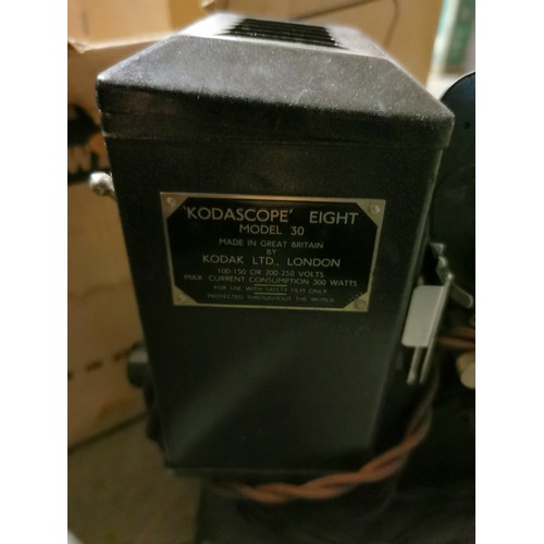 173 - Kodak Brownie Eight-58 projector in original box and with some pre-recorded film reels