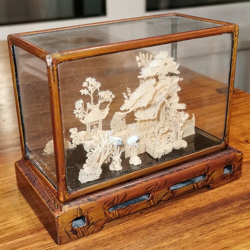 133 - 15 x 8 x 12 cm vintage Chinese carved cork ornament in glass display