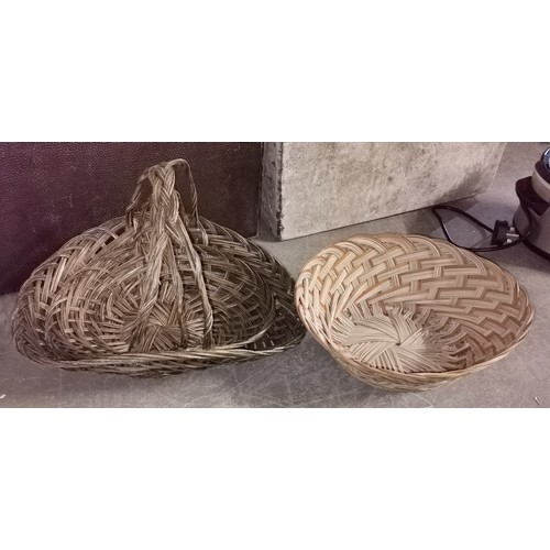 66 - Graduated pair of wicker flower baskets and other wicker bowl