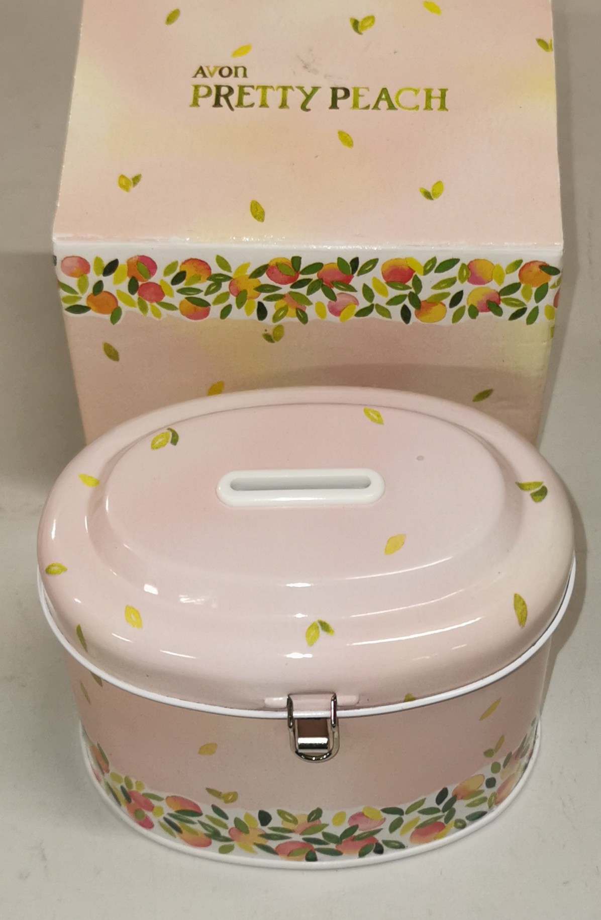 Boxed vintage Avon Pretty Peach tin money/safe box with key