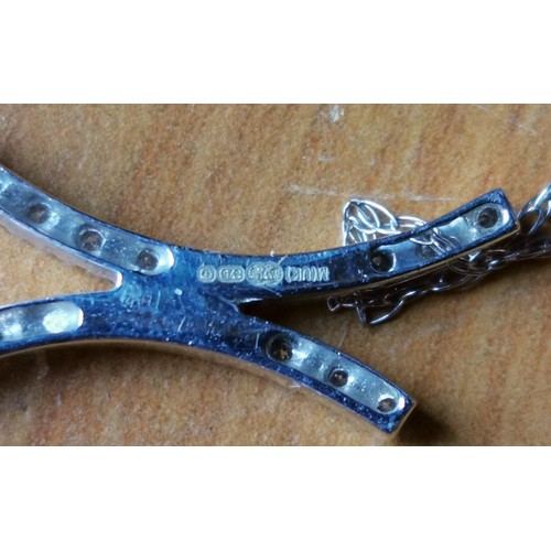 47 - 9 ct hallmarked white gold pendant with 16 x diamonds on matching fine 18