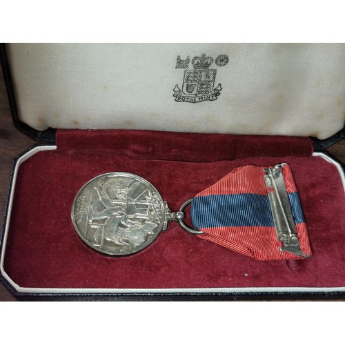 12 - Imperial service medal in case engraved on edge 'Ellis Sparshott Rowland'