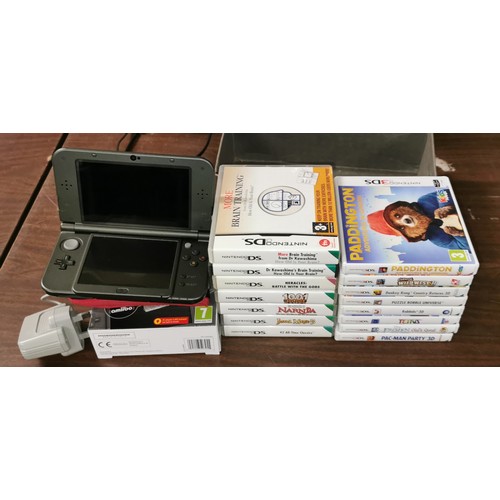 59 - Boxed Nintendo 3DS XL with case, charger, 8 x 3DS games and 7 x DS games