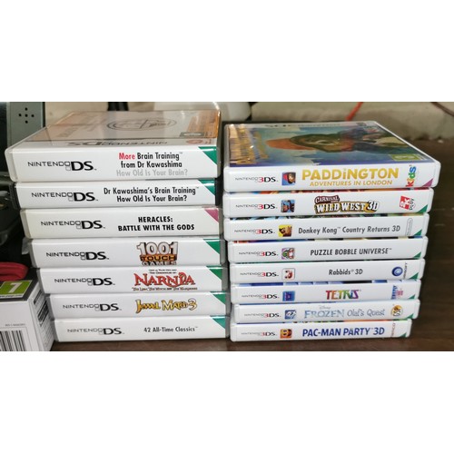 59 - Boxed Nintendo 3DS XL with case, charger, 8 x 3DS games and 7 x DS games