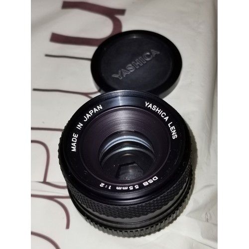 23 - Retro Yashica FX-3 35 mm camera with 55 mm Yashica lens and Vivitar 28-85 mm lens in canvas carry ba... 