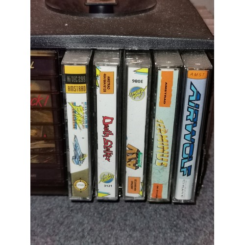 253 - Tape carousel containing 20 x assorted Amstrad games