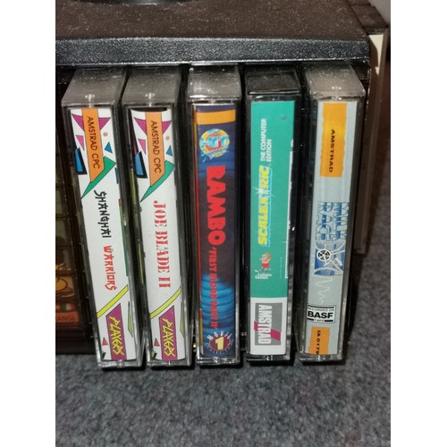 253 - Tape carousel containing 20 x assorted Amstrad games