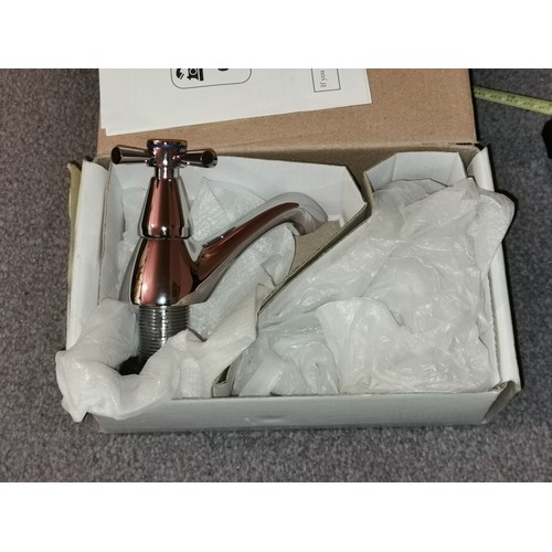 429 - Boxed and unused pair of bath taps