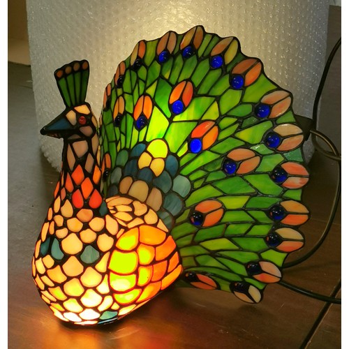 107 - Approx 24 cm long and 30 cm tall, Tiffany style peacock shaped lamp