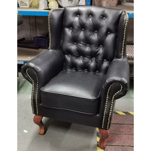 176 - Black Chesterfield style wing back armchair