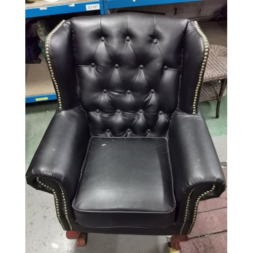 176 - Black Chesterfield style wing back armchair