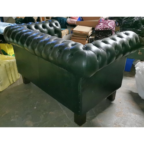 210 - Racing green 2 seater mid back Chesterfield couch on legs