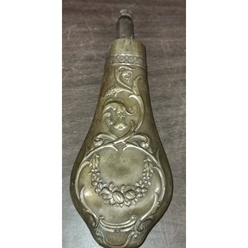 62 - 19th century brass gunpowder flask with embossed pattern