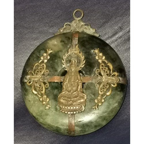 11 - Approx 5.5 cm diameter jade amulet with yellow metal  detailing