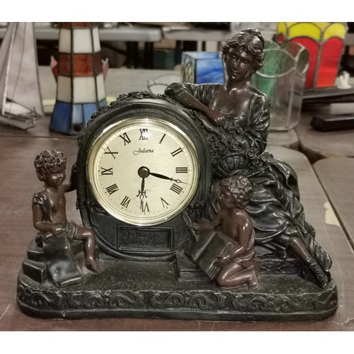 146 - 23 x 10 x 19 cm bronze look figural quartz, Roman numeral mantle clock