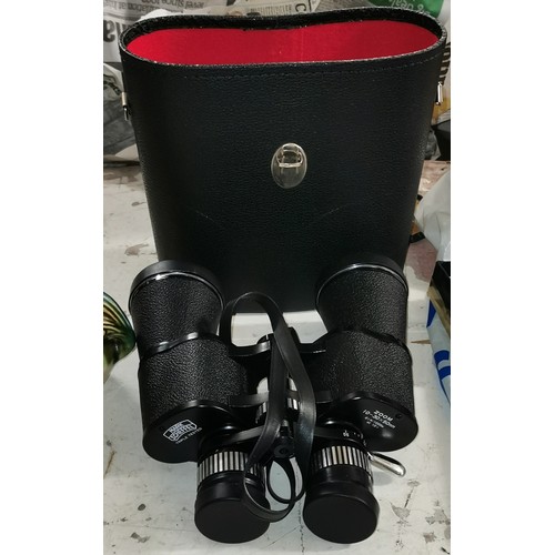 67 - Pair of Mark Scheffel 10-30 x 50 binoculars in case