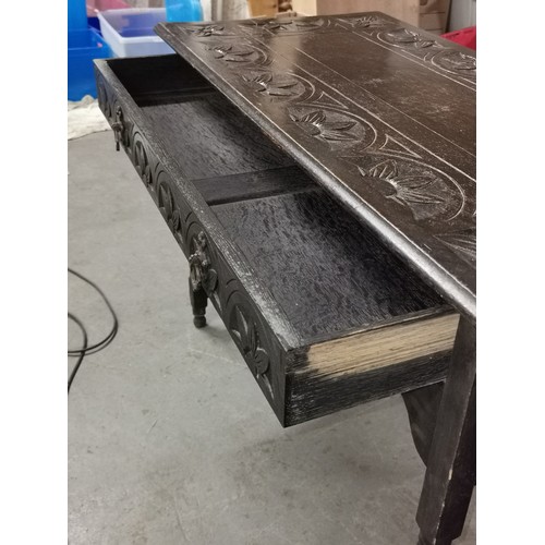 287 - 107 x 52 x 73 cm carved table with full length drawer - split on top