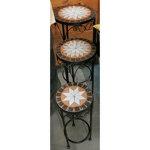 106 - Graduated trio of iron frame and mosaic top plant stands - tallest 70 cm