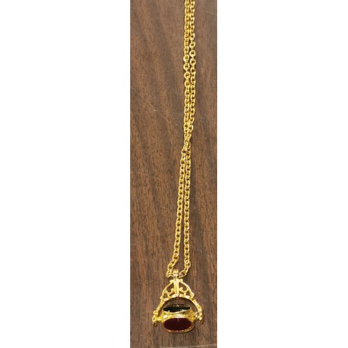 115 - gold tone rotating fob pendant on 30