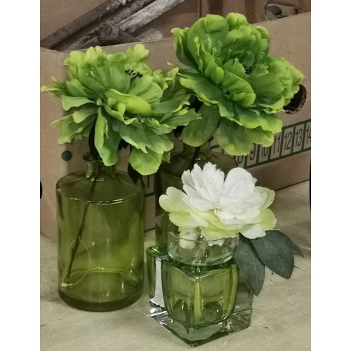 33 - Pair of 16 cm tall plus 1 x similar smaller green glass vases with artificial flowers