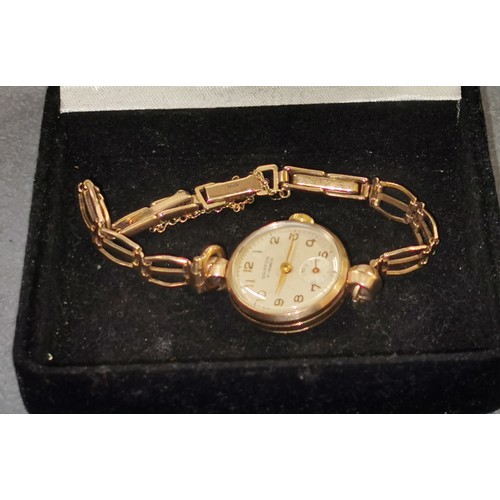 414 - Working ladies vintage Griffon 21 jewel 9 ct gold watch with 9 ct gold bracelet strap. Engraved pres... 