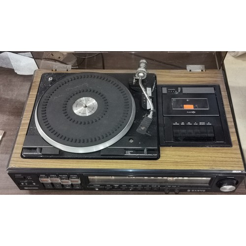 334 - Vintage Sanyo stereo music centre model JXT 4406 - attic stored, tape and radio work but turntable s... 