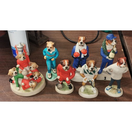 62 - Bundle of 7 x assorted boxer dogs dressed in sporting attire figures, largest being 16.5 cm