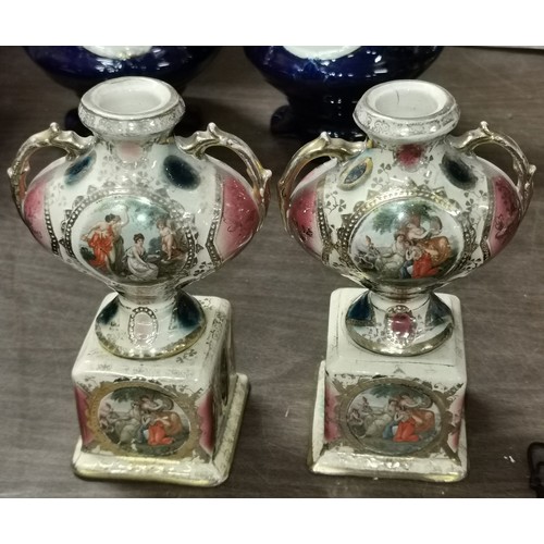 28 - Pair of 32 cm tall vintage 2 handle vase garnitures and pair of smaller Royal Vienna painted twin ha... 