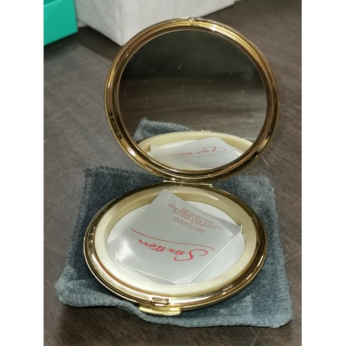 24 - Unused gilt Stratton compact with floral bouquet picture lid and pouch