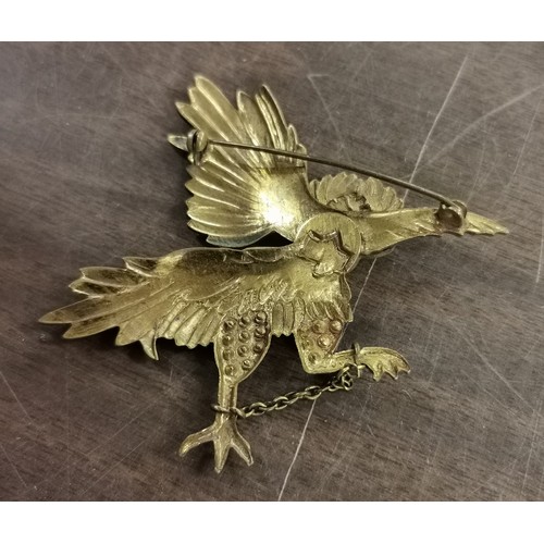 54 - 8 cm wide and 7 cm tall gold tone with jewels (some missing) large griffin brooch