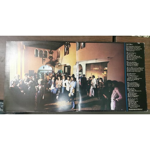 321 - The Eagles - Hotel California vinyl album, with poster present, in very good condition