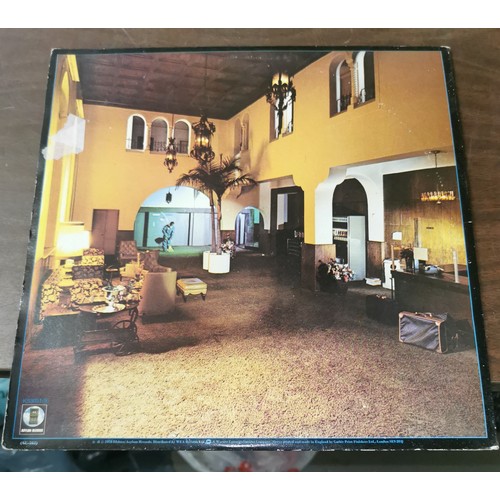 321 - The Eagles - Hotel California vinyl album, with poster present, in very good condition