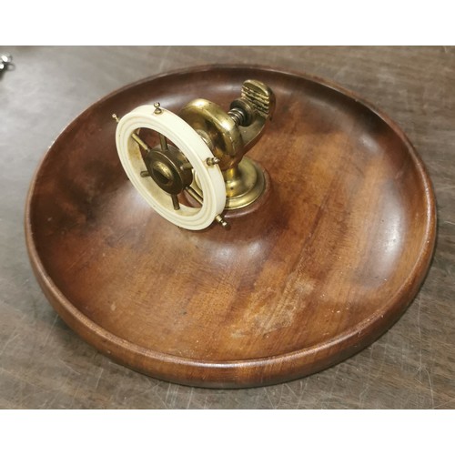 389 - 24 cm diameter wooden nut dish with ships wheel centre nut cracker