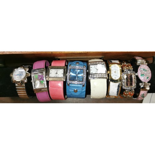 575 - Job lot of assorted gents and ladies quartz watches on wicker basket