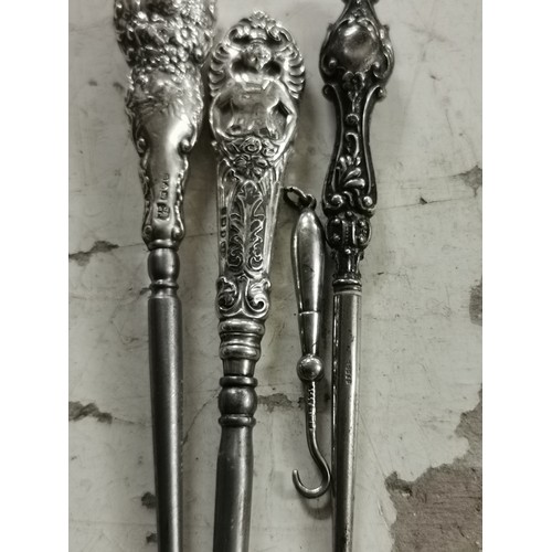 726 - 4 x assorted size hallmarked silver handle hooks