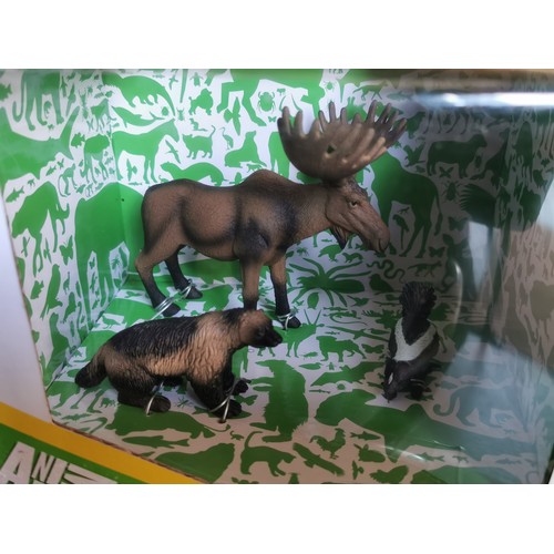 19 - New and boxed Animal Planet Deluxe figures set of North American animals being moose, striped skunk ... 